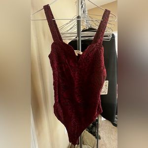 BURGUNDY COLORED BODY SUITE